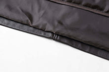 Load image into Gallery viewer, Close-up of REED men's jacket featuring genuine lambskin leather with lining and seam detail.