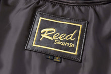 Load image into Gallery viewer, REED jacket label showing "Reed Since 1950" embroidery on black lambskin leather coat.