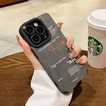 Cargar imagen en el visor de la galería, Luxury Leather Sneaker Phone Case on iPhone, sleek design with suede leather, held by person near coffee cup, stylish and protective.