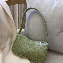 Load image into Gallery viewer, Green crocodile pattern PU leather women's shoulder bag on beige sofa, perfect for stylish travel and versatile occasions.