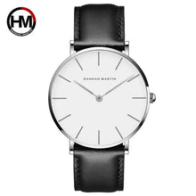 Cargar imagen en el visor de la galería, Minimalist silver dial watch with black leather strap, featuring sleek design perfect for both casual and formal occasions.