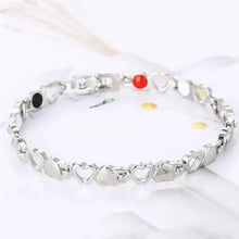 Load image into Gallery viewer, Silver magnetic therapy bracelet with heart links enhancing energy and vitality, featuring stylish design for well-being improvement.
