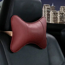 Cargar imagen en el visor de la galería, PU leather car neck pillow on a car seat at night, providing head support and comfort for long drives, in vegan leather design.