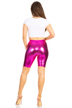 Cargar imagen en el visor de la galería, Back view of person wearing shiny metallic pink bike shorts, showcasing stretchy fit and high-quality made in USA craftsmanship.