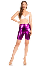 Cargar imagen en el visor de la galería, Woman wearing shiny metallic purple bike shorts, stretchy and unisex, made in USA, showcasing fit and style.