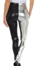 Cargar imagen en el visor de la galería, Person wearing shiny liquid metallic high waist stretch leggings in black and silver, side view, made in USA.