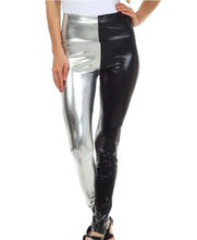 Cargar imagen en el visor de la galería, Shiny liquid metallic high waist stretch leggings in silver and black, made in USA, worn by model, highlighting sleek fit and style.