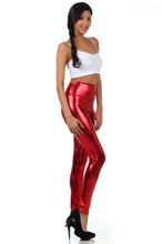 Cargar imagen en el visor de la galería, Model wearing shiny red liquid metallic high waist stretch leggings, made in USA, paired with white tank top and black heels.