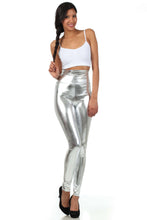 Cargar imagen en el visor de la galería, Model wearing shiny liquid metallic high waist stretch leggings with white top, showcasing Sakkas bold color design, made in USA.