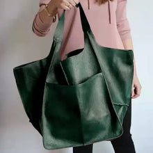 Cargar imagen en el visor de la galería, Green PU leather shoulder bag with a woman wearing a pink top, showcasing spacious and stylish design for daily use.
