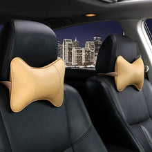 Cargar imagen en el visor de la galería, PU leather car neck pillow on car seat for head pain relief and comfort, vegan leather, imported, city skyline background