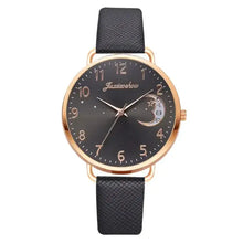 Charger l'image dans la galerie, Elegant moon-themed watch with dark face, gold markers, and black leather strap, perfect for adding celestial charm to any outfit.