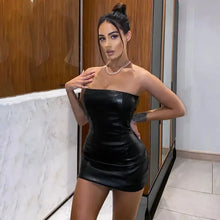 Cargar imagen en el visor de la galería, Woman wearing a chic faux leather dress, showcasing sleek design and sophisticated silhouette for a confident, stylish look.