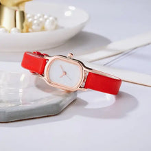 Charger l'image dans la galerie, Oval Dial Retro Watch with red strap on a marble surface, showcasing its vintage-inspired elegance and unique oval face design