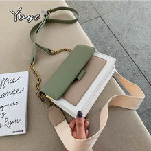 Cargar imagen en el visor de la galería, Stylish leather crossbody bag with green and beige color-block design, ideal for shopping and everyday use, on a modern floor background.