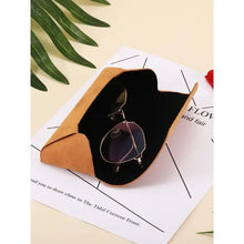 Cargar imagen en el visor de la galería, Fashion PU Leather Sunglasses Case with glasses on a magazine, featuring high-quality material and chic design.