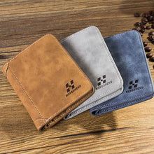 Cargar imagen en el visor de la galería, EliteFold Leather Wallets in brown, gray, and blue hues showcasing style and practicality on a wooden surface.