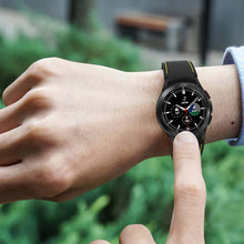Cargar imagen en el visor de la galería, Person wearing Samsung Galaxy Watch 4 Classic with 20mm silicone sports bracelet, highlighting style and functionality.