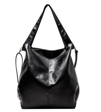 Cargar imagen en el visor de la galería, Sleek black PU leather shoulder tote with spacious design, ideal for stylish everyday use, featuring vegan-friendly material.