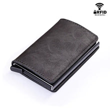 Load image into Gallery viewer, RFID leather credit card holder with automatic closure, vegan leather, sleek design, measures 10x7x1.5 cm, blocks signals.