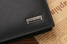 Cargar imagen en el visor de la galería, Close-up of men's premium leather wallet corner with branding on a rustic background