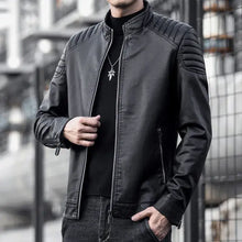 Charger l'image dans la galerie, Men's vegan leather motorcycle jacket in black, perfect for sleek style and protection on rides, featuring quilted shoulders and zippered pockets.