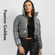 Cargar imagen en el visor de la galería, Woman wearing a glossy grey puffer jacket with a high collar and black pants, featuring the phrase 'Passion Goddess' on the left.