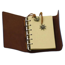 Cargar imagen en el visor de la galería, Anchor-Faux Leather Cover Notebook with anchor charm, open to show lined pages, perfect for capturing ideas and dreams in style.