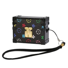Cargar imagen en el visor de la galería, Luxury patterned black case with gold clasp and detachable strap for tech accessories.