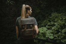 Charger l'image dans la galerie, The Hagen Backpack | Vintage Leather Backpack on person in natural forest setting