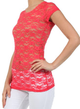 Charger l'image dans la galerie, Woman wearing stretch floral lace cap sleeve tunic tee in red, featuring scoop neckline and slim fit, paired with white pants.