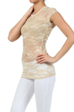 Charger l'image dans la galerie, Model wearing stretch floral lace cap sleeve tunic length tee in beige, showcasing sheer lace design and slim fit. Made in USA.