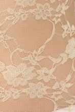 Charger l'image dans la galerie, Close-up of delicate sheer floral lace fabric in beige, showcasing intricate lace pattern and texture, ideal for the tunic stretch tee.