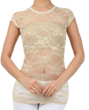 Charger l'image dans la galerie, Woman wearing stretch floral lace cap sleeve tunic tee, sheer design, scoop neckline, perfect for layering in beige color.