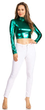 Load image into Gallery viewer, Woman wearing a metallic green liquid mock neck turtleneck long sleeve crop top paired with white jeans, standing with hands on hips.