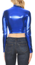 Load image into Gallery viewer, Back view of a metallic blue mock neck long sleeve crop top paired with denim jeans, showcasing shiny fabric and modern style, Made in USA.