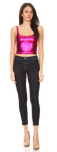 Cargar imagen en el visor de la galería, Woman wearing a shiny pink sleeveless metallic crop top with skinny jeans, showcasing club fashion style.