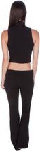 Charger l'image dans la galerie, Back view of a woman wearing a black mock neck turtleneck sleeveless scuba crop top, paired with matching pants, showcasing chic style.