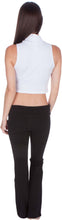 Charger l'image dans la galerie, Back view of a model wearing a white mock neck sleeveless scuba crop top paired with black pants.