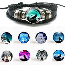Cargar imagen en el visor de la galería, Handmade leather wolf bracelet with full moon design, featuring intricate wolf imagery and premium quality craftsmanship.