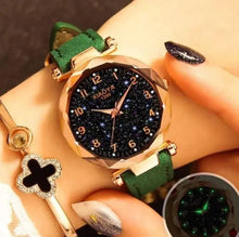 Cargar imagen en el visor de la galería, Premium star sky watch with vegan leather band and celestial design on wrist, showcasing elegant and unique craftsmanship.