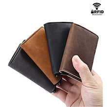 Load image into Gallery viewer, RFID Lock Vintage Automatic Leather Card Holder in brown and black vegan leather, shown in hand, featuring RFID blocking technology.