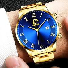 Charger l'image dans la galerie, Stylish minimalist men's watch with blue dial and gold strap, featuring Roman numerals for a sleek, elegant look.