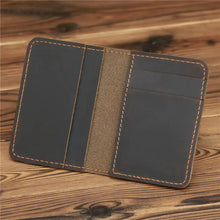 Load image into Gallery viewer, Vintage men's genuine leather credit card holder wallet on wooden surface, open to display compartments for cards and cash.