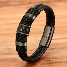 Cargar imagen en el visor de la galería, Woven leather rope stainless steel men's bracelet on a wood background, showcasing sleek and durable design.