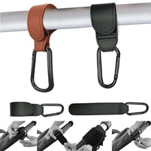 Cargar imagen en el visor de la galería, PU Leather Baby Stroller Hooks showing 360-degree rotation, easy attachment on pram, perfect for organizing bags and toys.