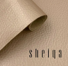 Charger l'image dans la galerie, Tan leather fabric roll with brand logo, showcasing texture and quality for leather repair and restoration.