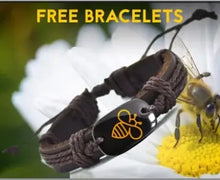 Cargar imagen en el visor de la galería, Bee bracelet with leather band on a daisy flower background with 'Free Bracelets' text.