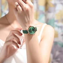 Cargar imagen en el visor de la galería, Woman wearing a Classic Clock Leather Watch with elegant design and green strap, showcasing its stylish and fashionable appeal.