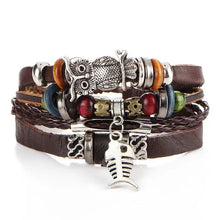 Charger l'image dans la galerie, Multilayer leather bracelet with beads, owl and fish charms, showcasing rugged elegance and craftsmanship, perfect for any occasion.